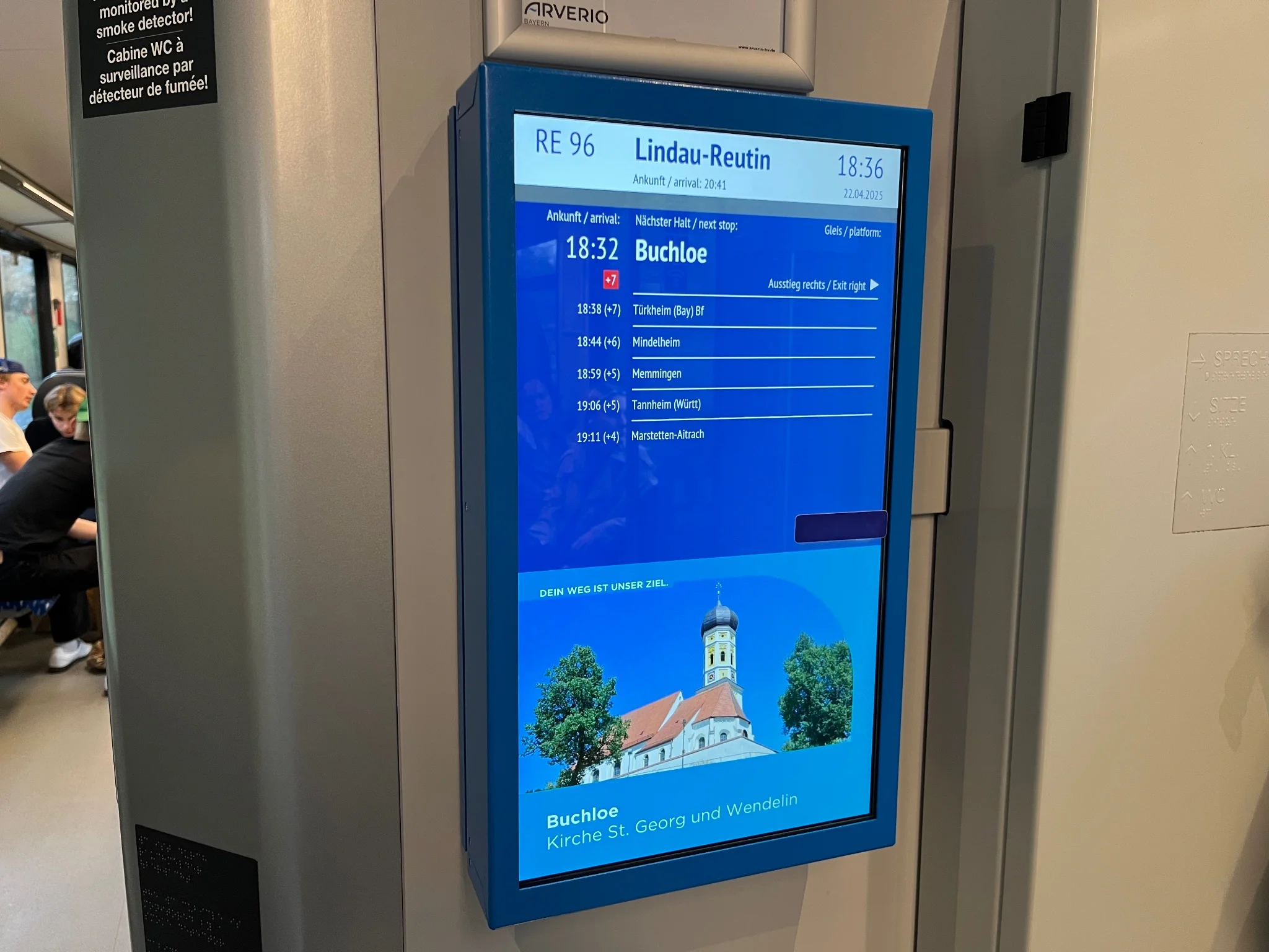 Passenger information screen with a blue sticker applied in the bottom right part of the part displaying timetable information 